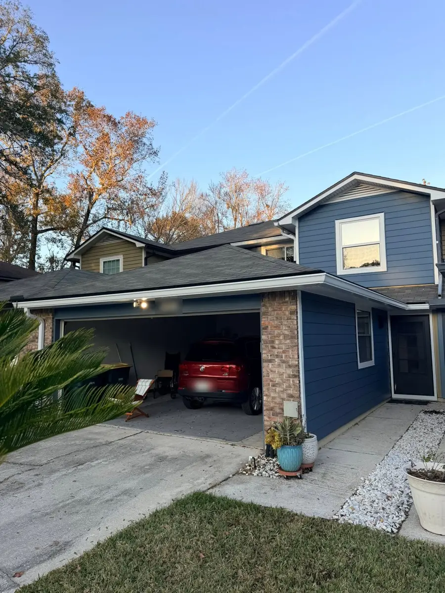 Blue townhome with new siding