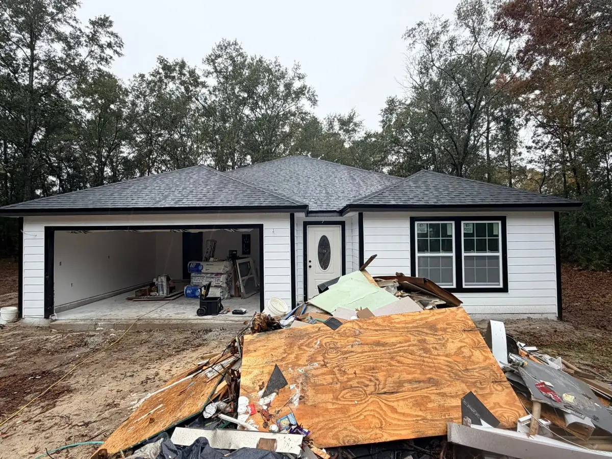 New white siding home with black trim